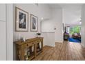 Bright and airy entryway with wood console table and tasteful wall art at 4811 Bayshore Blvd # 302, Tampa, FL 33611