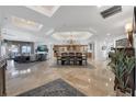 Bright living area with a dining table, kitchen, and seating area with incredible ocean views at 16300 Gulf Blvd # 300B, Redington Beach, FL 33708