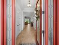 View through the front door, showing a light and bright entryway and living room at 4719 Cassio Ct, Bradenton, FL 34211