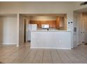 Open living room featuring tile floors and an open concept to the kitchen at 5125 Palm Springs Blvd # 1303, Tampa, FL 33647