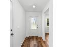 Bright and airy entryway with wood-look flooring at 5473 Colfax Ter, Port Charlotte, FL 33981