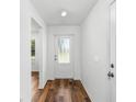 Bright entryway with wood-look flooring and white door at 5307 Burgner St, Port Charlotte, FL 33981