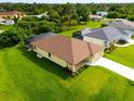 An aerial view of a house with a pool and a large backyard at 9187 Prospect Ave, Englewood, FL 34224