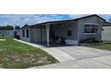 Mobile home with carport and side yard at 1710 7Th Sw St # 103, Ruskin, FL 33570