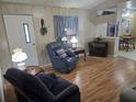 Cozy living room with recliner and hardwood floors at 1710 7Th Sw St # 103, Ruskin, FL 33570