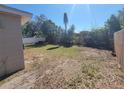 The spacious back yard is enclosed by a mix of wood and PVC fencing at 4305 E Deleuil Ave, Tampa, FL 33610