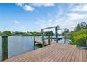 Wooden dock with lift and waterfront views at 429 Flamingo Dr, Apollo Beach, FL 33572