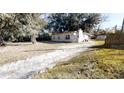 Single-story house exterior with a driveway at 17130 Pasco Acres Dr, Spring Hill, FL 34610