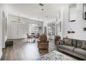 Bright and spacious living room with hardwood floors at 6120 Cezanne Ave, Lutz, FL 33558