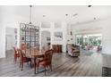 Elegant dining room featuring hardwood floors and a chandelier at 6120 Cezanne Ave, Lutz, FL 33558