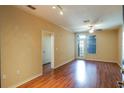 Spacious living room with hardwood floors and ceiling fan at 4221 W Spruce St # 1310, Tampa, FL 33607