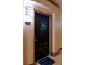 Private condo entrance with a black door and welcome mat at 4221 W Spruce St # 1310, Tampa, FL 33607