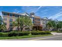 Luxury apartment building with a gated entrance and landscaping at 4221 W Spruce St # 1310, Tampa, FL 33607