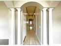 Elegant entryway with columns and tiled flooring at 12009 Pennfield Pl, Riverview, FL 33579
