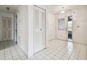 Bright entryway with tile flooring and double door closet at 1606 Laughton Pl, Sun City Center, FL 33573