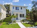 Charming two-story house with manicured lawn and updated exterior at 2909 W Spruce St, Tampa, FL 33607