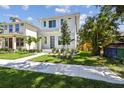 Well-maintained home with green lawn, blue door, and landscaped front yard at 2909 W Spruce St, Tampa, FL 33607