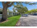 Exterior view of building with ample parking and mature landscaping at 11200 102Nd Ave # 60, Seminole, FL 33778