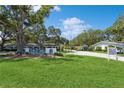 Entrance to Twin Oaks community, featuring a well-maintained landscape at 11200 102Nd Ave # 60, Seminole, FL 33778