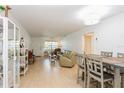 Living room with light beige sofas, wood floors, and a dining area at 11200 102Nd Ave # 60, Seminole, FL 33778