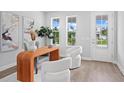 Bright office featuring a modern desk, stylish chairs, and ample natural light from large windows at 4017 W Fig St, Tampa, FL 33609