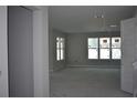 Bright living room with multiple windows allowing ample natural light to fill the space at 707 W Fribley St, Tampa, FL 33603