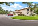 Attractive condo building with ample parking and lush landscaping at 19029 Us Highway 19 N # 4-5, Clearwater, FL 33764