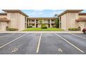 The Tangier building with parking lot at 19029 Us Highway 19 N # 4-5, Clearwater, FL 33764