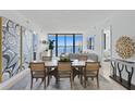 Elegant dining room with water views and modern decor at 2912 W Santiago St # 1703, Tampa, FL 33629