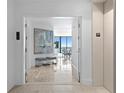 Bright condo entryway with modern art and hardwood floors at 2912 W Santiago St # 1703, Tampa, FL 33629