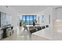 Open concept dining area with glass table and modern chairs at 2912 W Santiago St # 903, Tampa, FL 33629