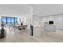 Modern kitchen with white cabinets, marble counters, and breakfast bar at 2912 W Santiago St # 903, Tampa, FL 33629