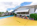 Mobile home exterior with unique driveway and landscaping at 7131 El Dewitt St, Zephyrhills, FL 33541