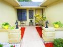 Front entry with walkway, landscaping, and lighting at 1306 Idlewood Dr # 53, Sun City Center, FL 33573