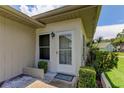 Neat front door entrance with landscaping at 3283 Hilary Cir # 2C, Palm Harbor, FL 34684