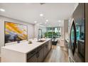 Modern kitchen with island and stainless steel appliances at 912 Channelside Dr # 2316, Tampa, FL 33602
