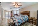 Main bedroom with rustic decor and access to patio at 10313 Widgeon Way, New Port Richey, FL 34654