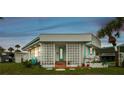 Mid-century modern mobile home with unique screen walls and landscaping at 4851 W Gandy Blvd # B5L25, Tampa, FL 33611