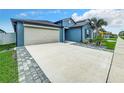 This lovely home boasts a spacious driveway and inviting front entrance at 13336 Great Plains Dr, Riverview, FL 33579