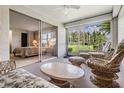 Bright Florida room with access to a bedroom and backyard view at 3332 Scorecard Dr, New Port Richey, FL 34655