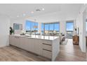 Modern kitchen with sleek cabinetry and a large island, open to the living area at 5120 Marina Way # 8805, Tampa, FL 33611