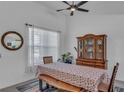 Spacious dining area featuring a live-edge table and hutch at 13333 Gershwin Ln, Port Charlotte, FL 33981
