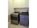 Well-lit laundry room, complete with washer and dryer at 277 Valencia Cir, St Petersburg, FL 33716