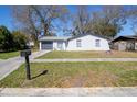 Charming single-story home features a well-maintained front yard and attached garage at 3432 Danny Bryan Blvd, Tampa, FL 33619
