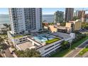 An aerial view of a building with a rooftop recreation area, including a basketball court at 2910 W Barcelona St # 903, Tampa, FL 33629