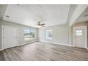 Bright living room with wood-look flooring and ample natural light at 5725 Newton S Ave, Gulfport, FL 33707