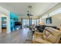 Spacious living room with hardwood floors and comfy seating at 1940 Inverness Greens Dr # 1940, Sun City Center, FL 33573