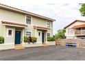 Two-story building with a shared parking area and lush landscaping at 6504 Abaco Dr # 101, Apollo Beach, FL 33572