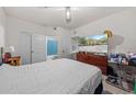 Bedroom with double bed, dresser, and en-suite bathroom at 17104 Carrington Park Dr # 528, Tampa, FL 33647