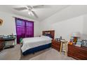 Bedroom with double bed, dresser, and window with curtains at 17104 Carrington Park Dr # 528, Tampa, FL 33647